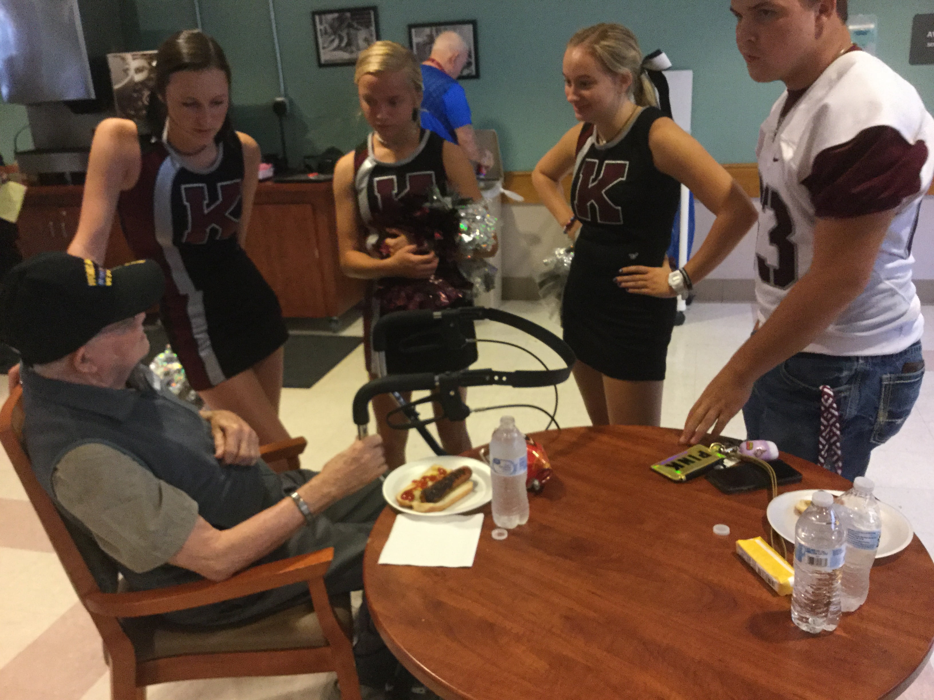 Whippets hold pep rally at veterans home, honor vets with helmet stickers