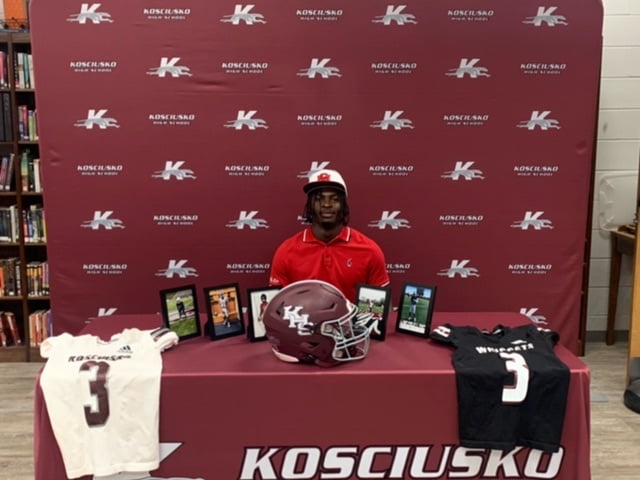 Photo: Whippet football star signs to play college football