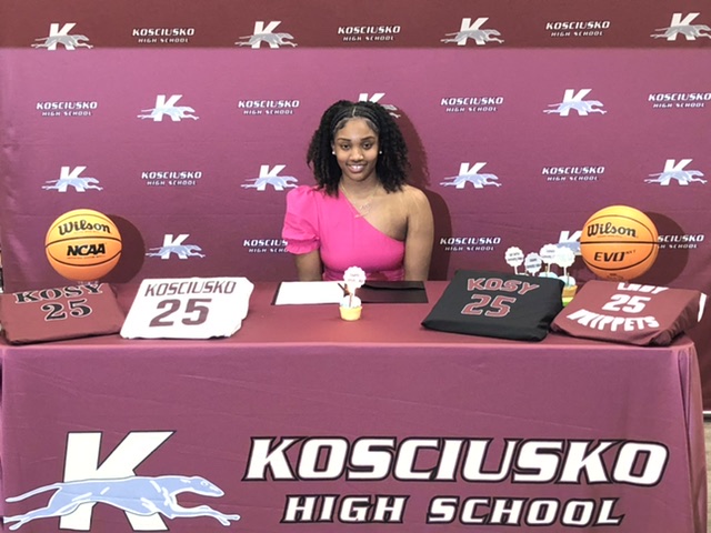 Photo: Lady Whippet basketball star signs to play college basketball