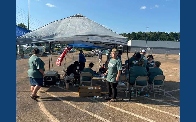Photos: Local church gives out water and prayer