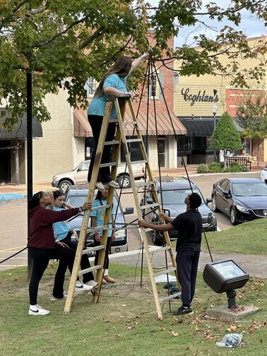 Photos: Local students help with Kosy Lights decorations
