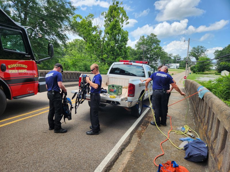 KFD members getting outfitted to rappel.
